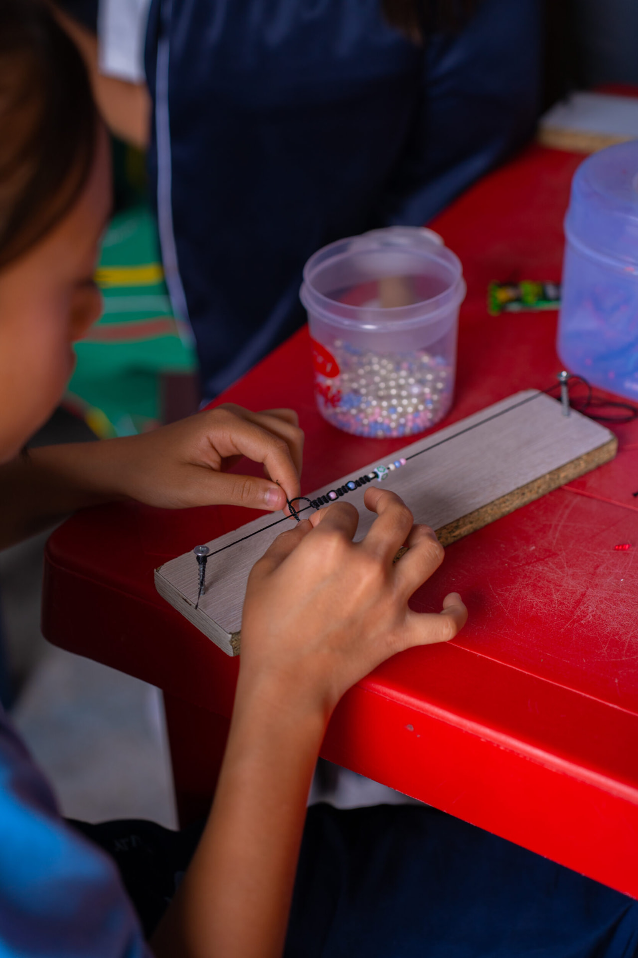 Volunteers and children inside the safe space