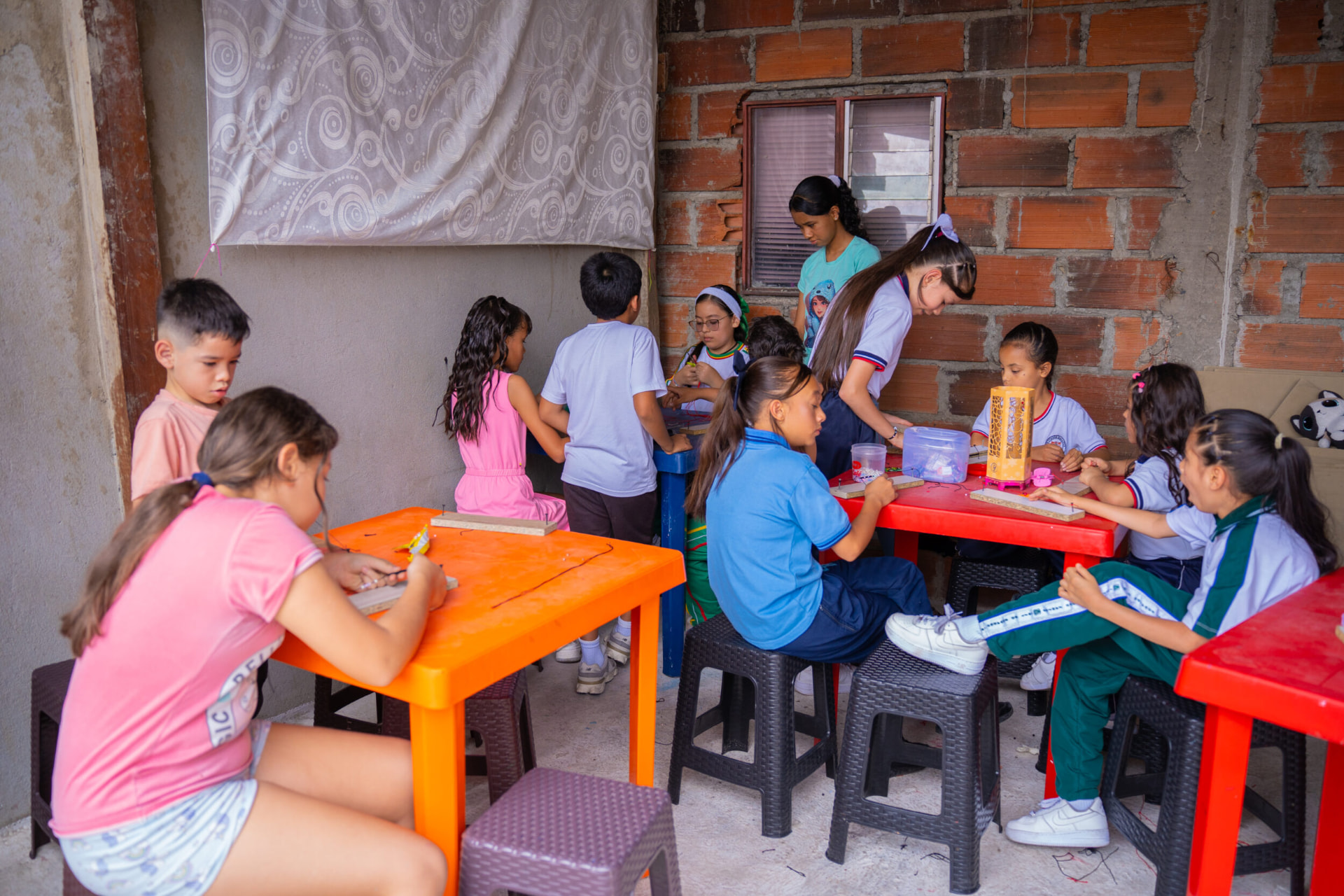 Orange and blue graffiti portrait mural in Comuna 13